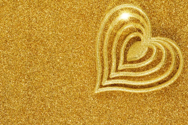 Coração em forma de ornamento no fundo de ouro brilho — Fotografia de Stock