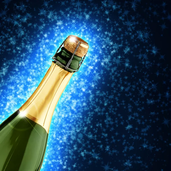 Champagne bottle in a starry blue background — Stock Photo, Image