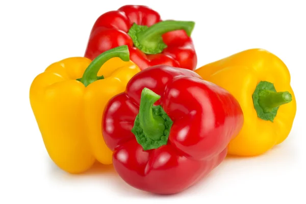 Red and yellow peppers isolated on white background — Stock Photo, Image