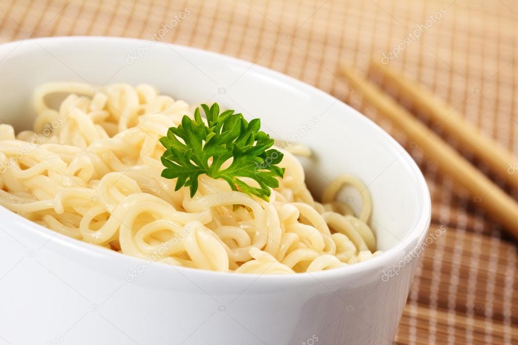 Close up of chinese noodles garnished with parsley