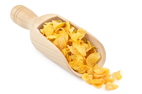 Corn flakes in a wooden scoop isolated on white background — Stock Photo, Image