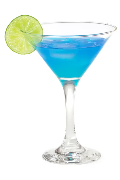 Blue cocktail in martini glass garnished with lime — Stock Photo, Image