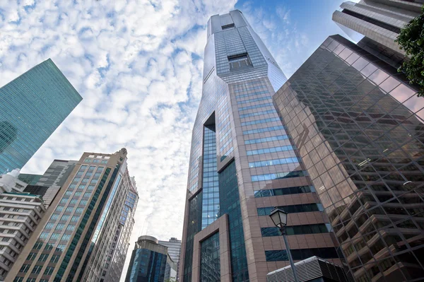 Skyscrapers in financial district under a cloudy sky — Stock Photo, Image