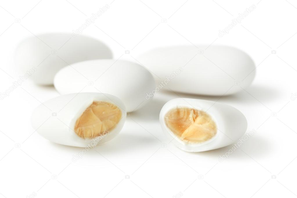 Close up of a sugar-coated almond on white background