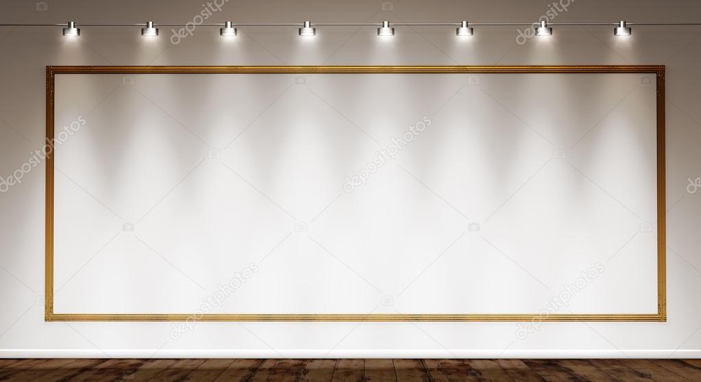 Golden frame on white wall illuminated by spotlights — Stock Photo
