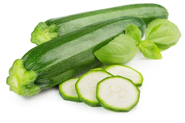 Twee courgette en basilicum blad geïsoleerd op witte achtergrond — Stockfoto