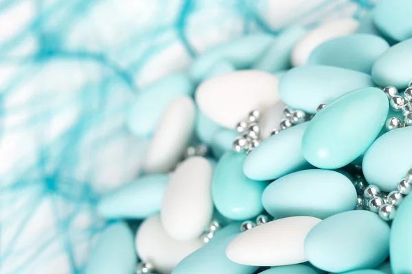 Heap of azure and white sugared almonds — Stock Photo, Image