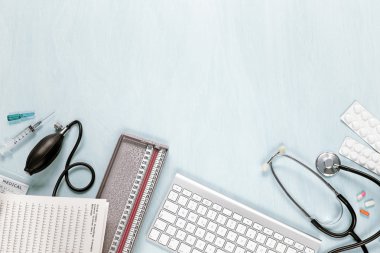 Top view of medical equipment on a blue desk