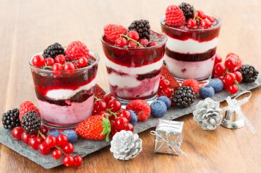 Dessert with berries, soft fruit and Christmas decorations
