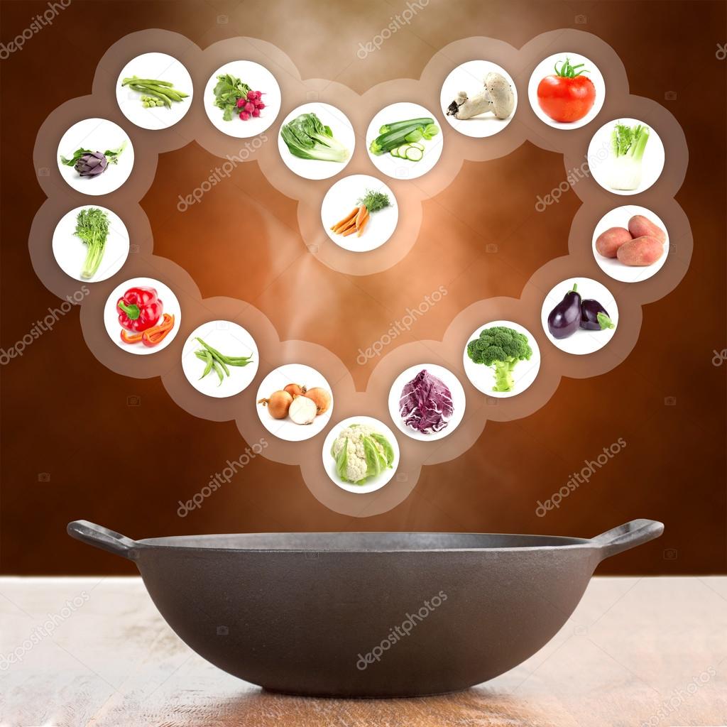 Vegetables in a heart shape over cast iron pot Stock Photo by ©paulistano  76184779