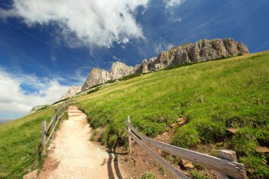 sloping mountain trail in the Italian Dolomites clipart