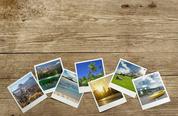 Schnappschüsse von Reisezielen auf hölzernem Hintergrund — Stockfoto