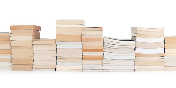 stacks of books in a row on white background