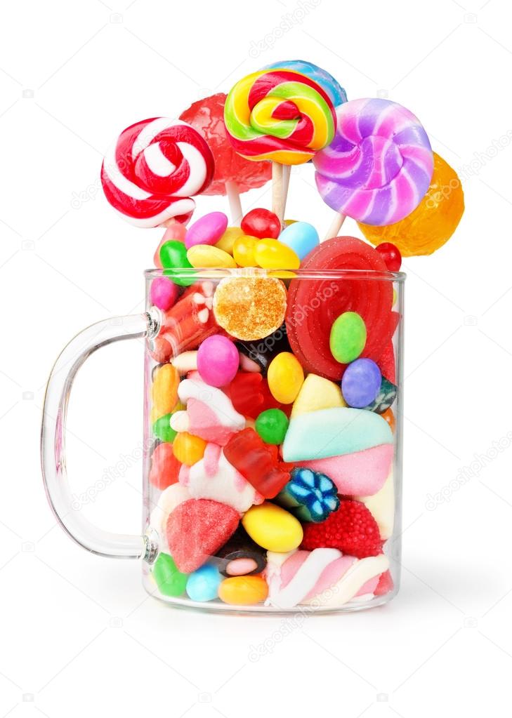 mug glass full of candies isolated on white
