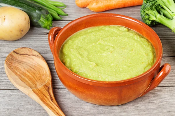 Vegetable soup, fresh ingredients and wooden spoon — Stock Image Vegetable soup, fresh ingredients and wooden spoon Stock Photo