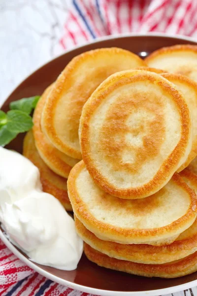 Fritters with sour cream — Stock Photo, Image