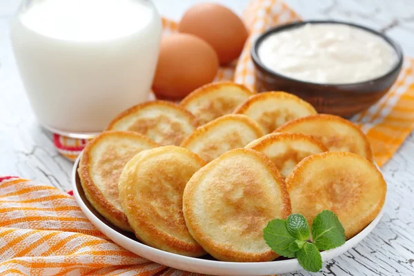 Pancakes with sour cream Stock Picture