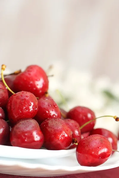 Sweet cherry on a plate Royalty Free Stock Images