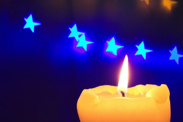 Candle light and stars on the dark background — Stock Photo, Image