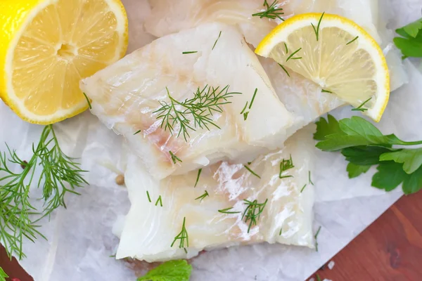 Raw fish on the wooden table — Stock Photo, Image