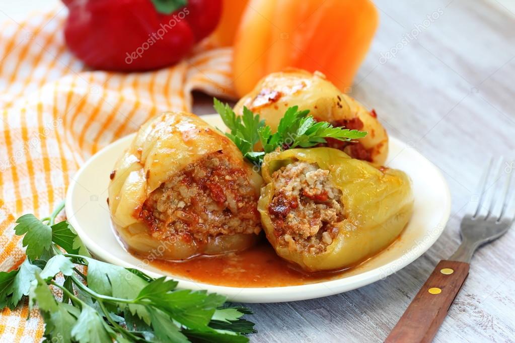 Baked peppers stuffed with meat, rice and vegetable