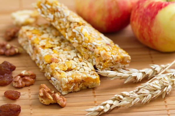 Cereal bars of granola with apples, nuts and raisins — Stock Photo, Image