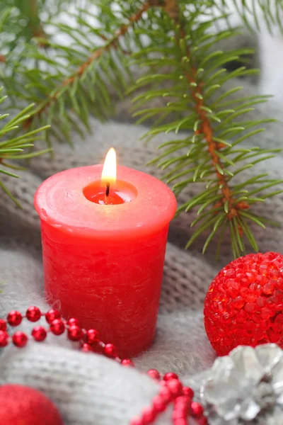 Red candle with christmas decoration — Stock Photo, Image