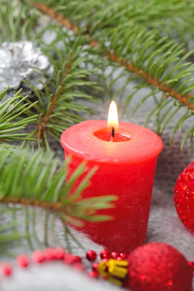 Red candle with christmas decoration Stock Picture