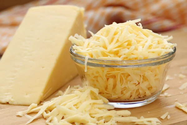 Grated cheese in a glass bowl — Stock Photo, Image