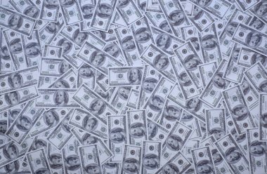 100 Amerikan Doları 'ndan oluşan bir grup fon dokusu üst görünümü banknotları