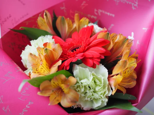 Close-up of a beautiful bouquet of assorted flowers of gerbera, hydrangea, rose, alstroemeria. floral background