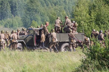 Kaluga region, Medyn, Russia - July 26, 2016: the reconstruction of the battle of Podolsk cadets of world war II clipart