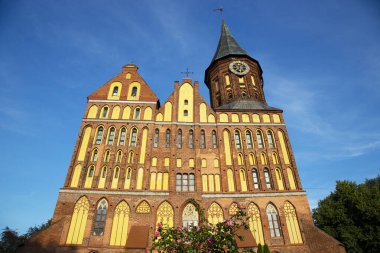 Immanuel Kant Cathedral in Kaliningrad, Russia. Former Konigsberg. The monument is a historic building on the background of blue sky clipart