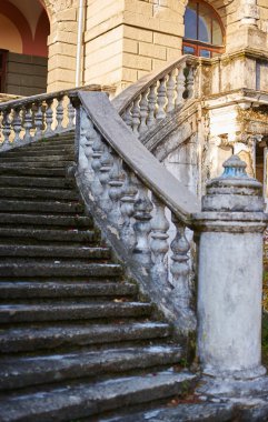 old style classic white stairs at the front of vintage building