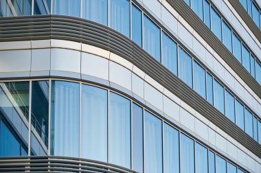 line of modern glass windows in fancy office building