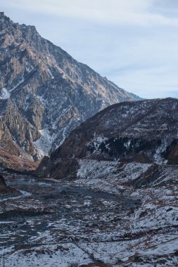 winter snowy mountains landscape view and rocks