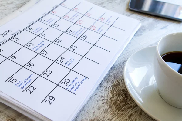 Checking monthly activities in the calendar — Stock Photo, Image