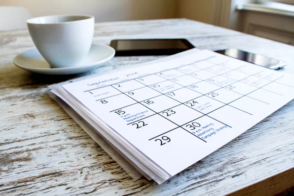 Checking monthly activities in the calendar — Stock Photo, Image