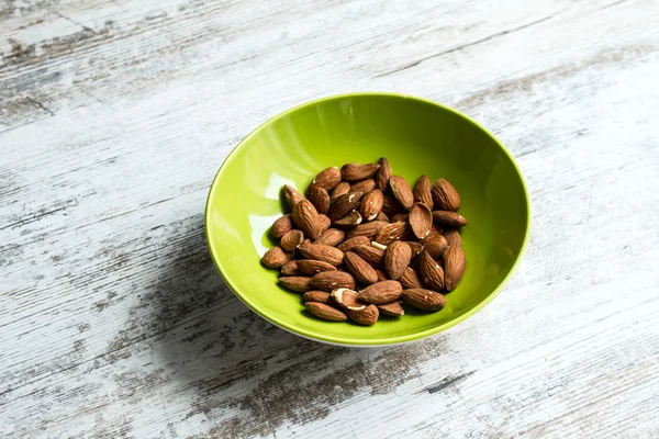 Almonds in a bowl — Stock Photo, Image