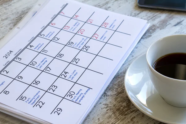 Checking monthly activities in the calendar — Stock Photo, Image
