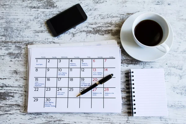 Checking monthly activities in the calendar — Stock Photo, Image