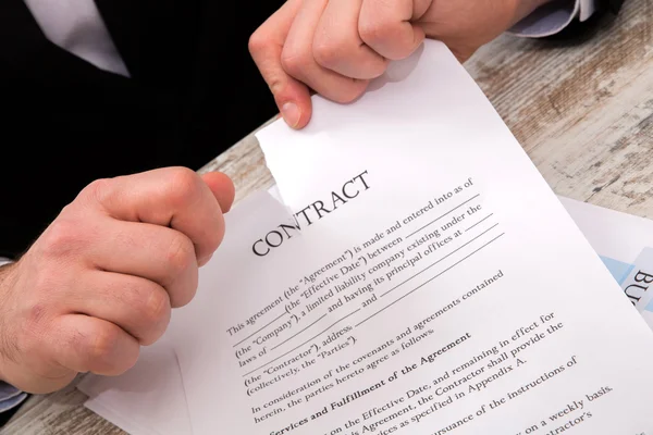 A businessman signing a Contract