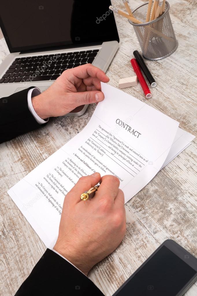 A businessman signing a Contract	