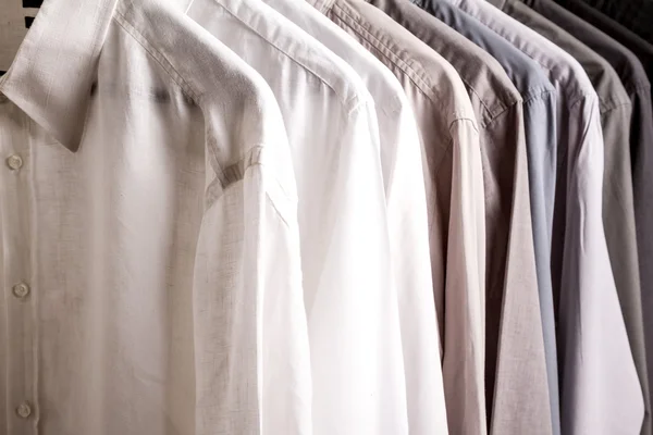 Several shirts on a hanger, background — Stock Photo, Image