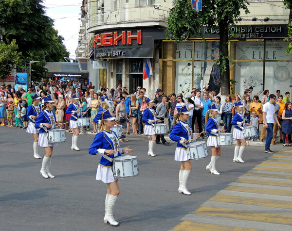Girl drummer band on the avenue