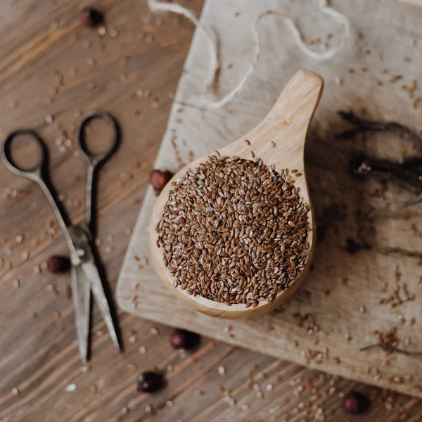 stock-photo-flax-linen-seeds-wooden-table