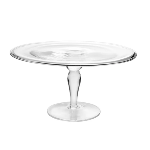 Supporto torta di vetro su tavolo bianco isolato su sfondo bianco — Foto Stock