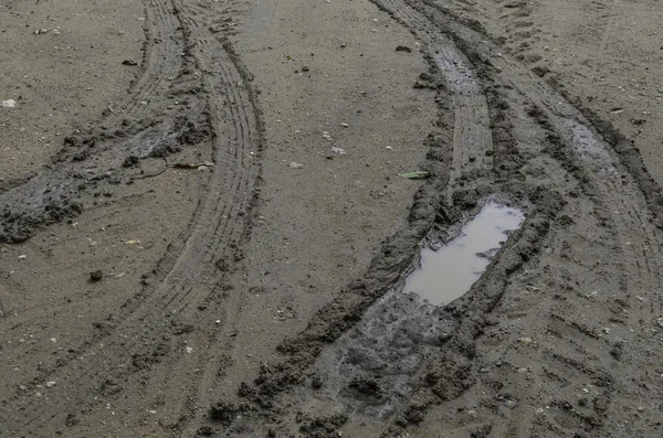 Muddy wet countryside road — Stock Photo, Image