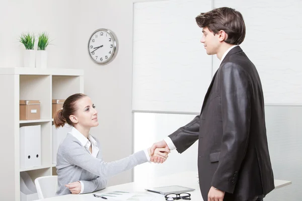 Business people having job interview with young woman — Stock Photo, Image