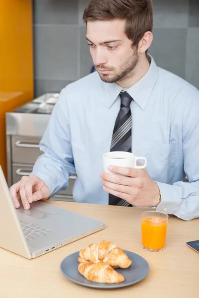 Businessman having breakfast — Stock Photo, Image